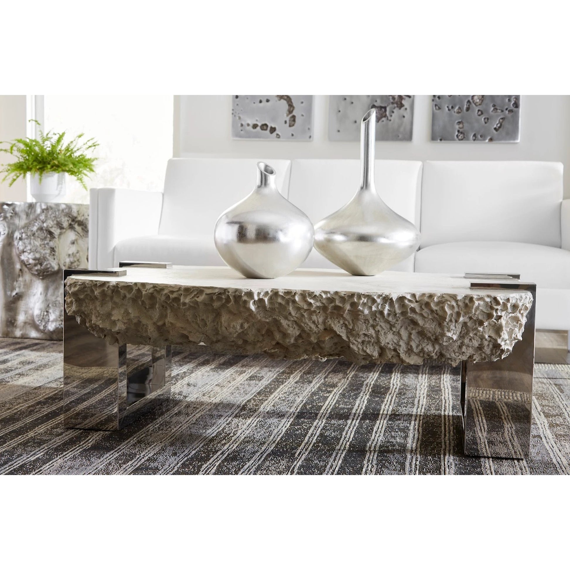 Negotiation Ash Coffee Table by Phillips Collection in gray, silver and ash. Made from resin metal in a modern style.