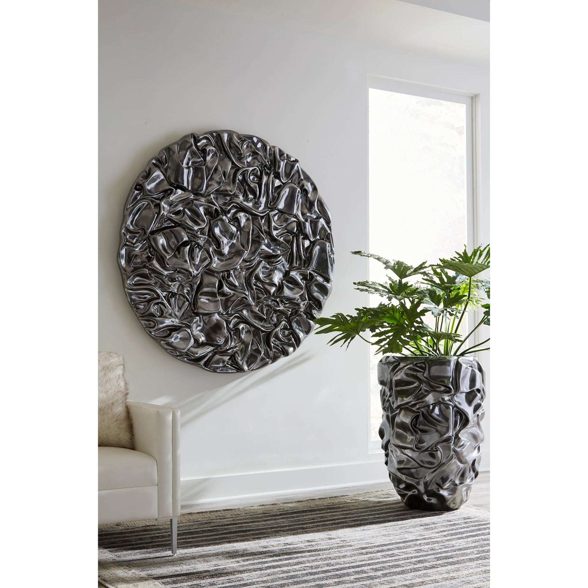 Drape Planter, Liquid Silver by Phillips Collection in liquid silver. Made from resin in a modern style.