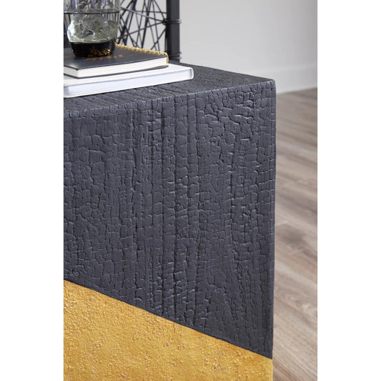 Scorched Side Table by Phillips Collection in black, gold and gold leaf. Made from resin in a modern style.