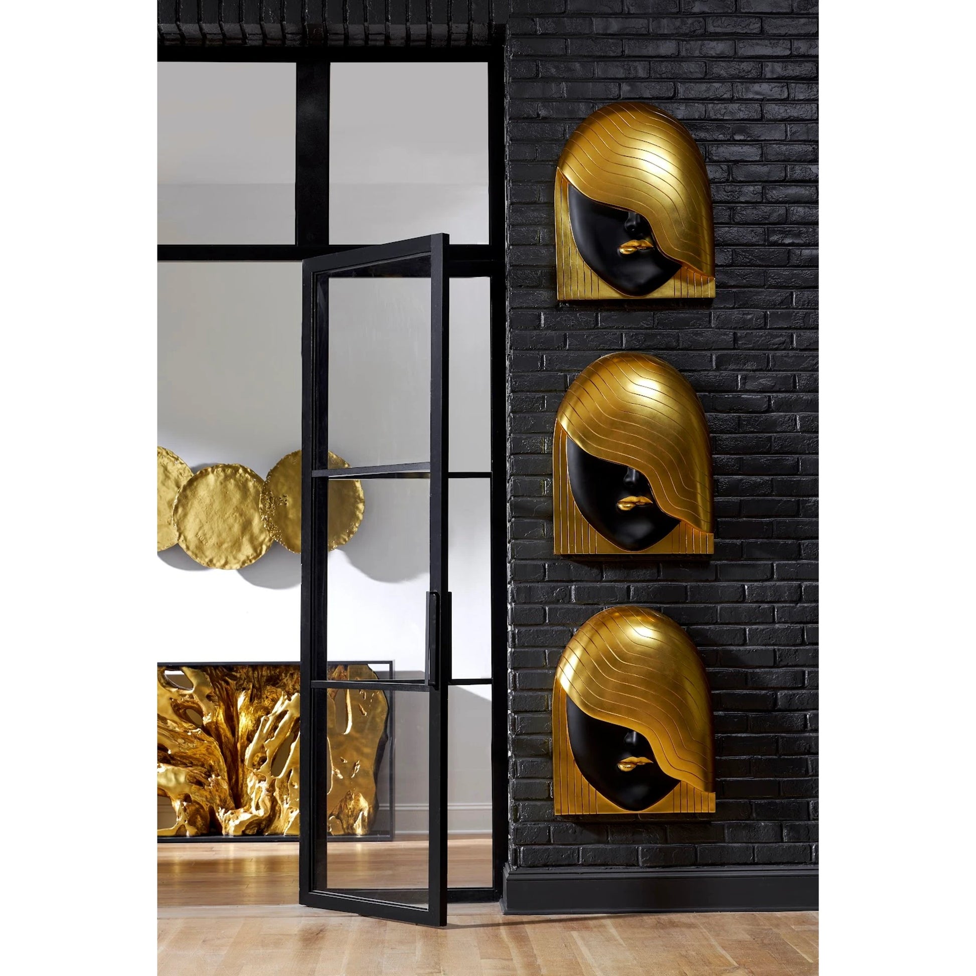 Fashion Faces Wave Large Black and Gold Wall Art by Phillips Collection in black, gold and gold leaf. Made from resin in a modern style.