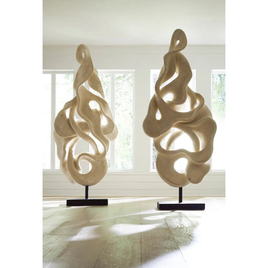Cast Dancing Sculpture Pli by Phillips Collection in off white, white and faux bleached. Made from resin in a unique style.