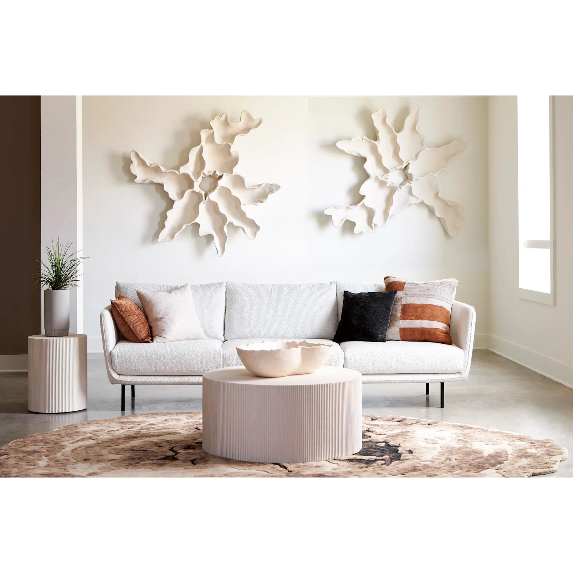 Groovy Coffee Table by Phillips Collection in white stone. Made from resin in a transitional style.