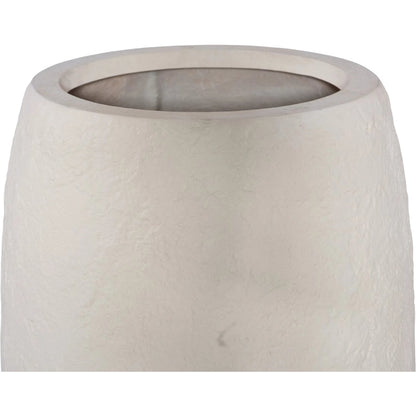 Aera Planter by Phillips Collection. Made from resin, stone composite in a unique style.