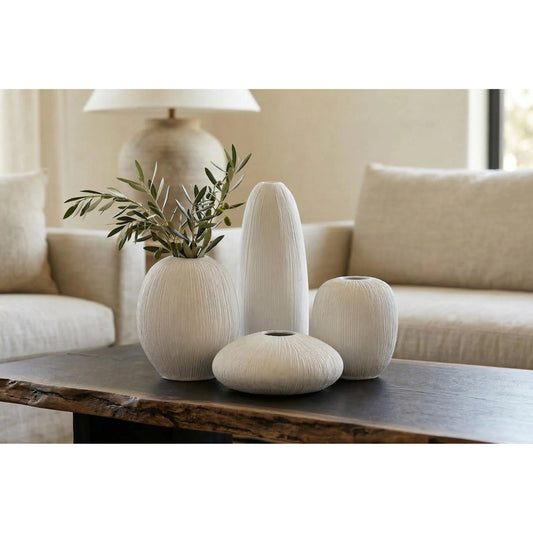 Vasti Vase by Phillips Collection in off white. Made from resin in a unique style.