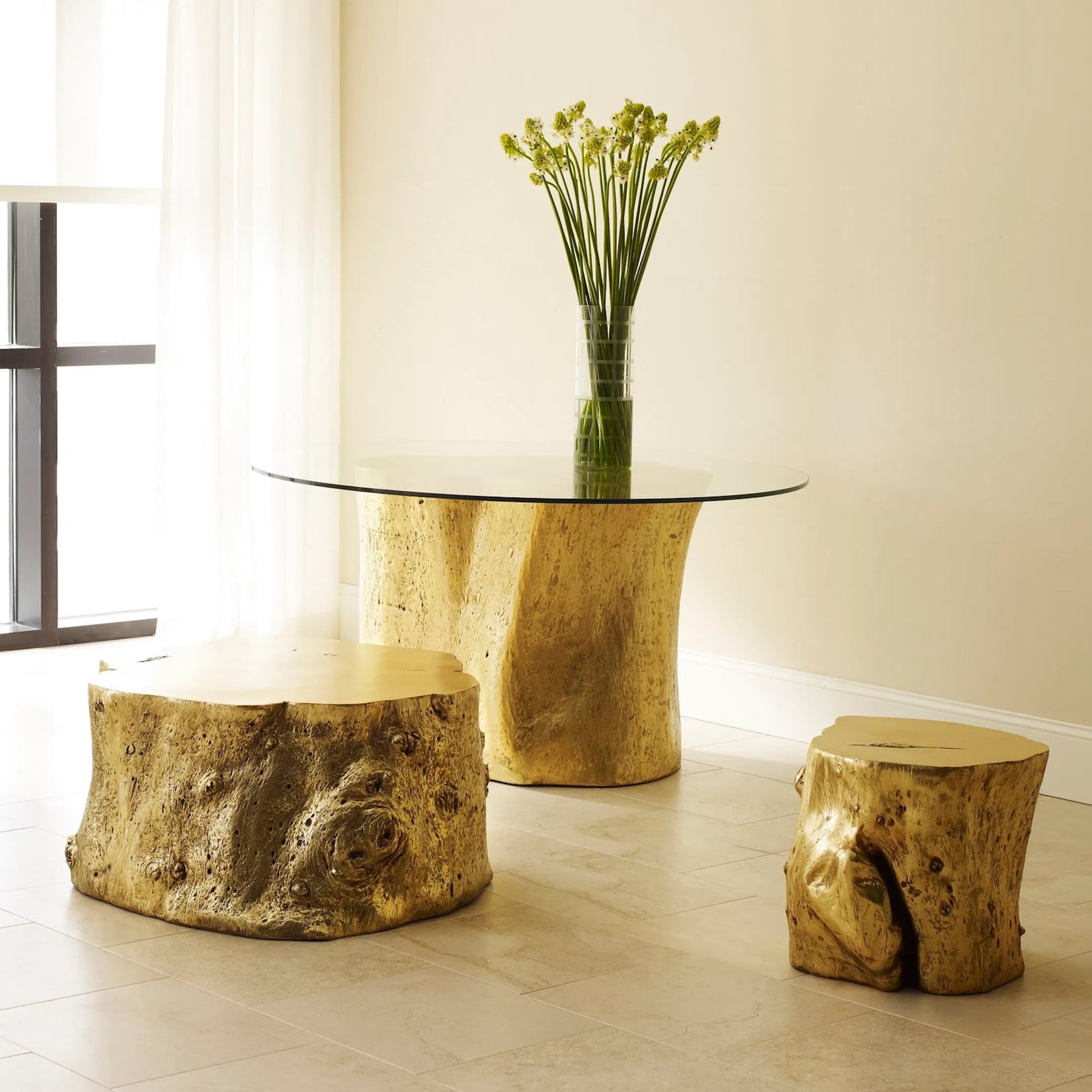 Log Gold Stool by Phillips Collection in gold and gold leaf. Made from resin in a eclectic & global style.