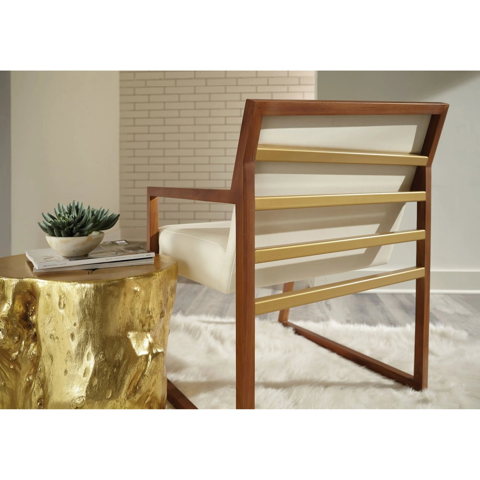 Log Gold Stool by Phillips Collection in gold and gold leaf. Made from resin in a eclectic & global style.