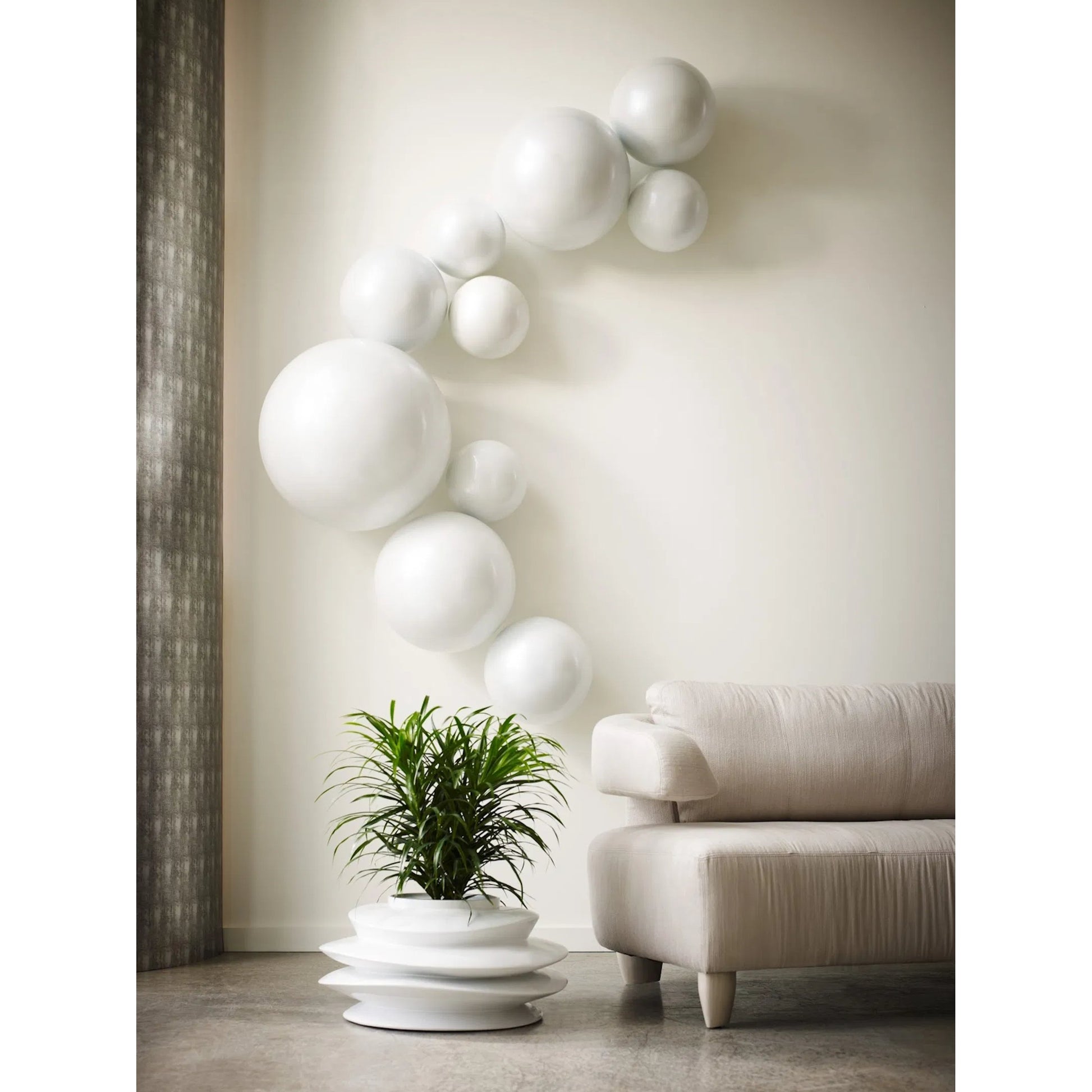 Ball on the Wall by Phillips Collection. Made from resin in a modern style.