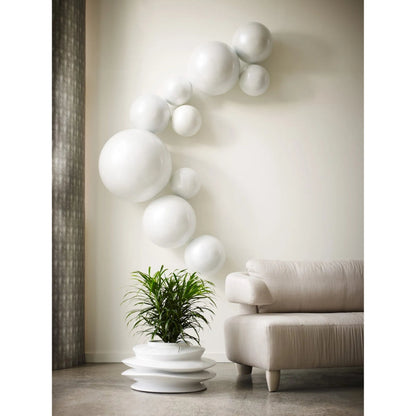 Ball on the Wall by Phillips Collection. Made from resin in a modern style.
