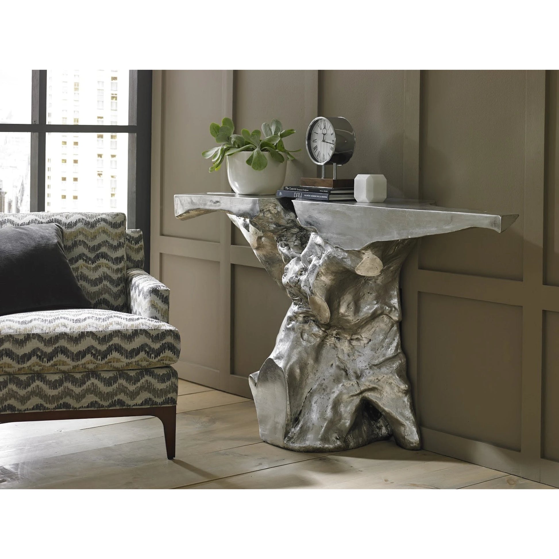 Crown Console by Phillips Collection in silver and silver leaf. Made from resin in a modern style.