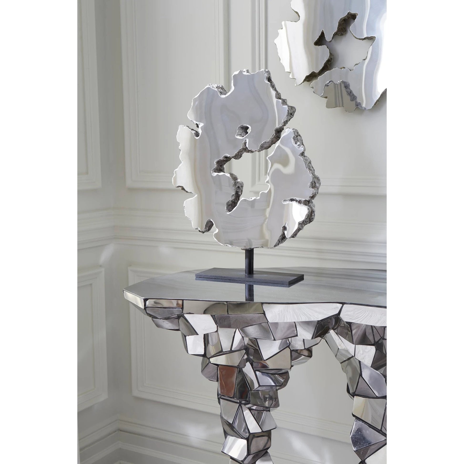 Radica Trizole Console by Phillips Collection in silver. Made from metal in a eclectic & global style.