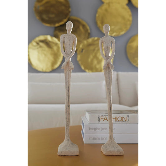 Skinny Male and Female Sculpture by Phillips Collection in off white and roman stone. Made from resin in a eclectic & global style.