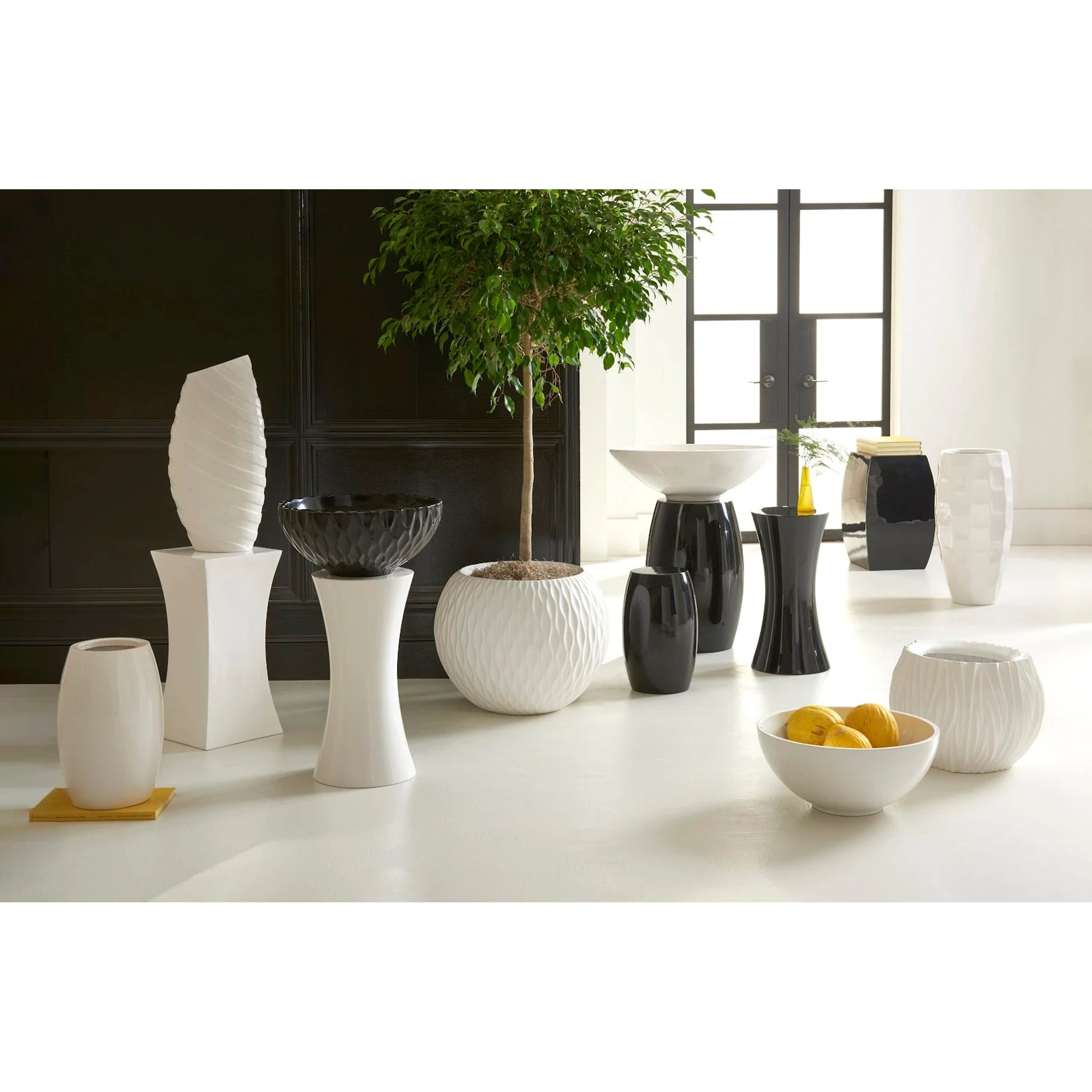 Mando Planter by Phillips Collection in white and gel coat. Made from resin in a modern style.