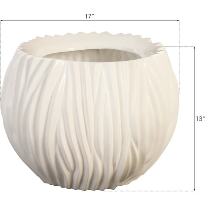 Alon Planter by Phillips Collection. Made from resin in a coastal style.