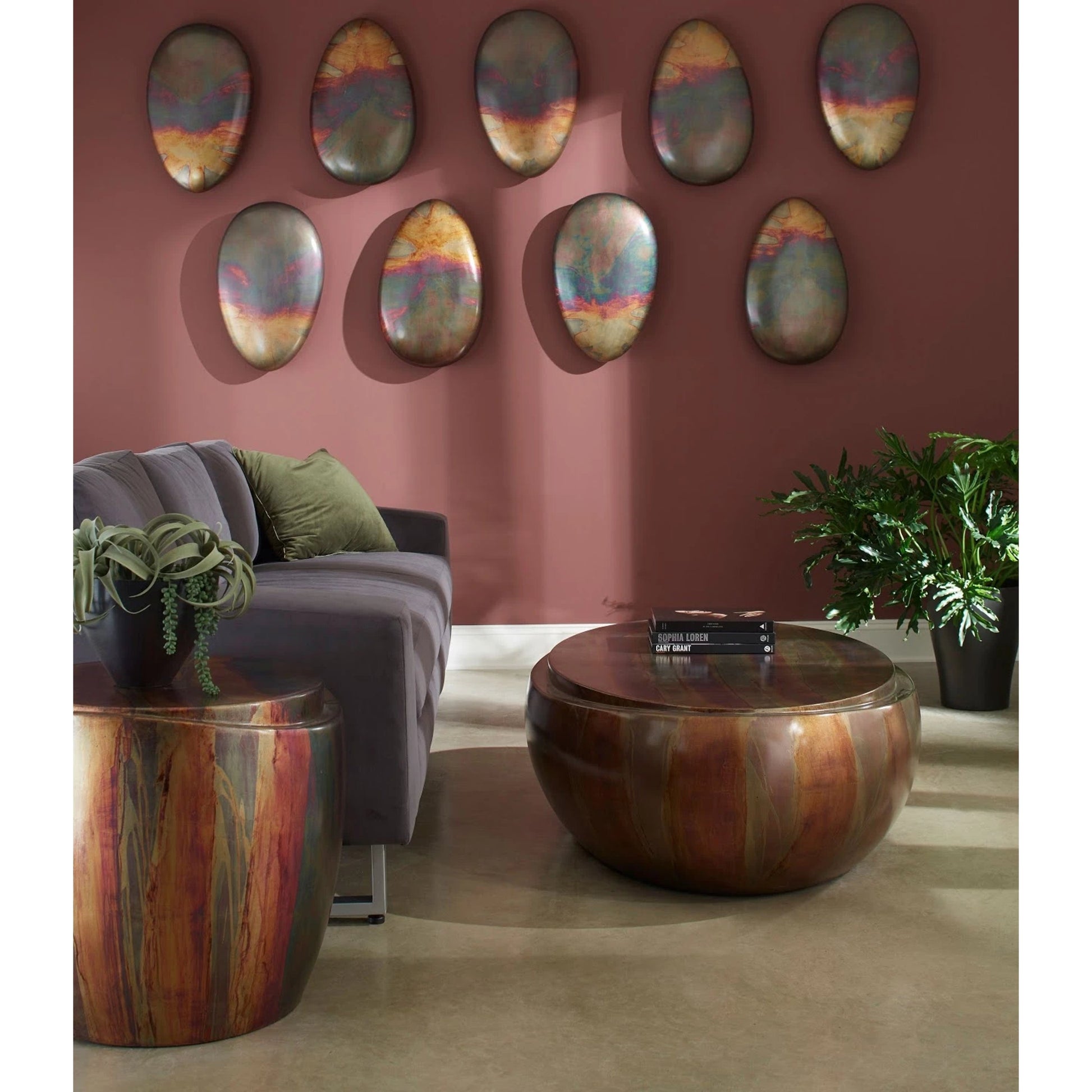Sweep Side Table by Phillips Collection in brown and copper patina. Made from resin in a eclectic & global style.