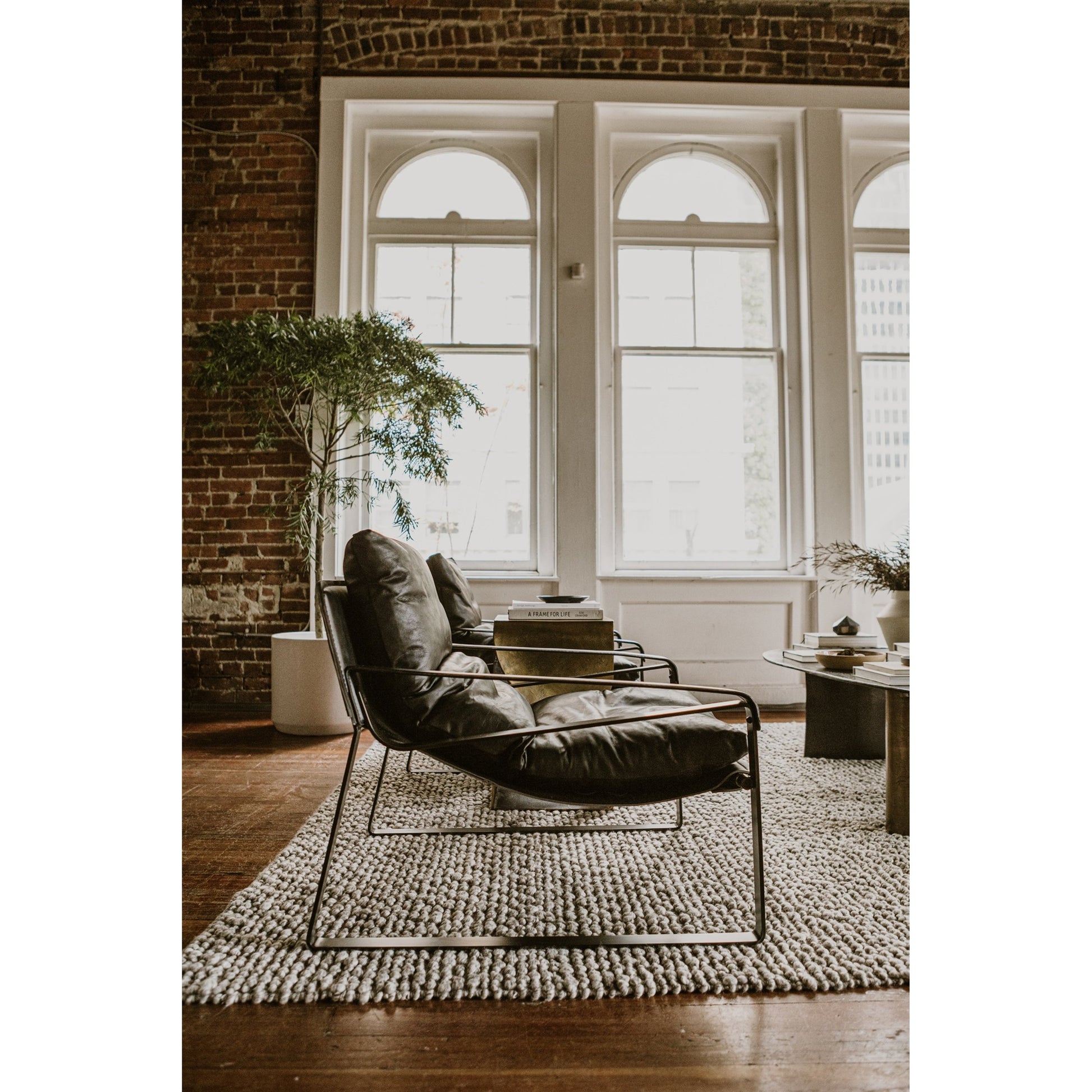 Connor Club Chair Open Road Leather by Moe's Home Collection. Made from upholstery: top-grain leather, iron frame, bonded leather cushion support, foam, feather fill in a modern style.