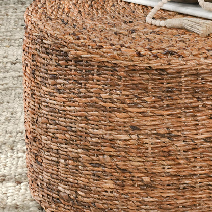 Ira Round Rattan Coffee Table by Kosas Home. Made from rattan abaca in a coastal style.