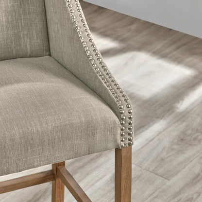 Castaic Counter Stool by Kosas Home in french beige, honey brown. Made from blended upholstery (28% linen, 18% polyester, 54% velvet, rubber wood legs in a modern style.