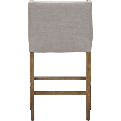 Castaic Counter Stool by Kosas Home in french beige, honey brown. Made from blended upholstery (28% linen, 18% polyester, 54% velvet, rubber wood legs in a modern style.