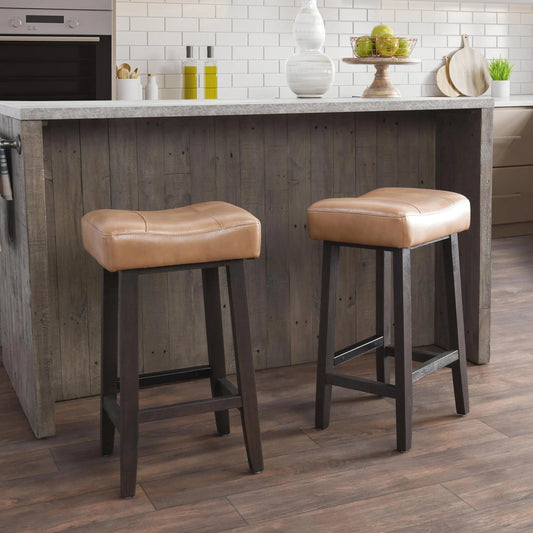 Lauri Counter Stool by Kosas Home in camel. Made from vegan leather top, rubberwood legs in a modern style.