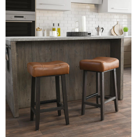 Laurie Counter Stool by Kosas Home in caramel. Made from vegan leather top, rubberwood legs in a rustic style.