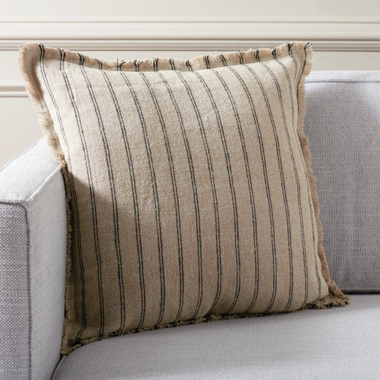 Clare Pillow by HedgeApple Essentials in natural, black. Made from linen, zipper, 100% virgin quality vacuum packed filler in a modern style.