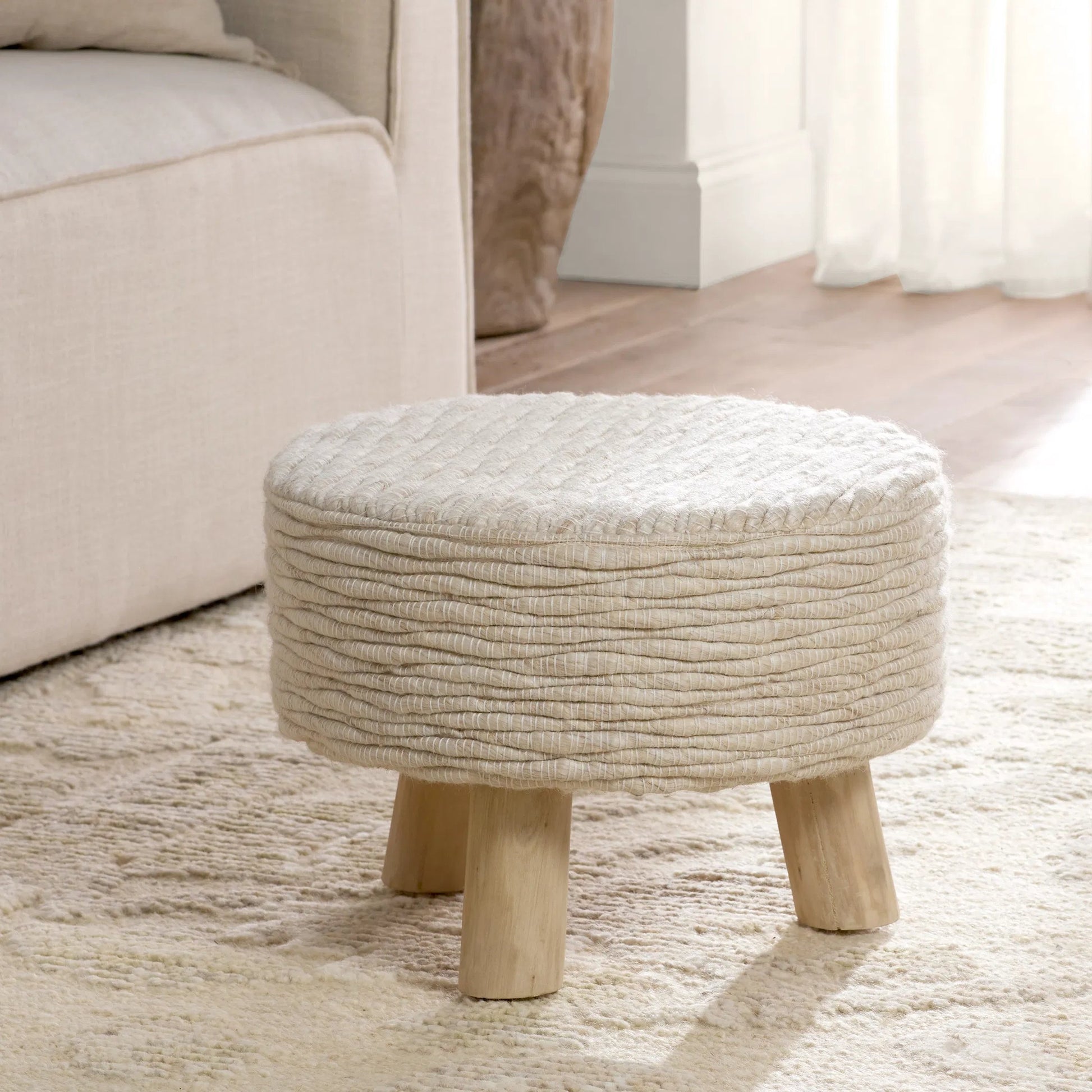 Penna PNA01 Pouf by Jaipur Living in cream, white. Made from 96% wool 4% cotton in a cottage & farmhouse style.