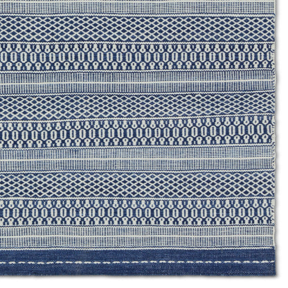 Penrose PNR06 Indoor/Outdoor Rug by Jaipur Living in navy, cream. Made from 100% polyester in a unique style.