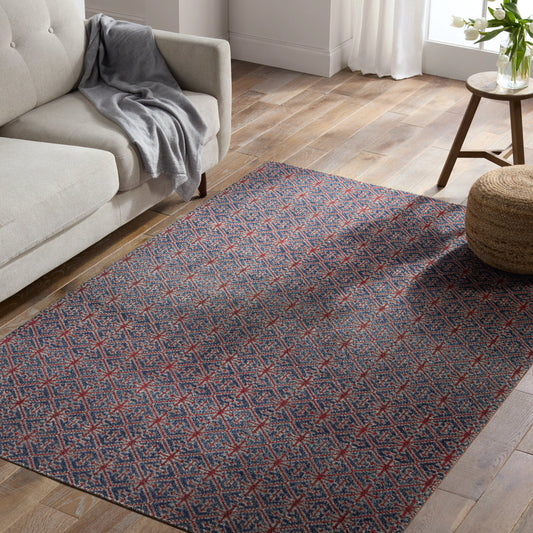 Polaris Darlita Rug by Jaipur Living in red, navy. Made from 100% polypropylene in a unique style.