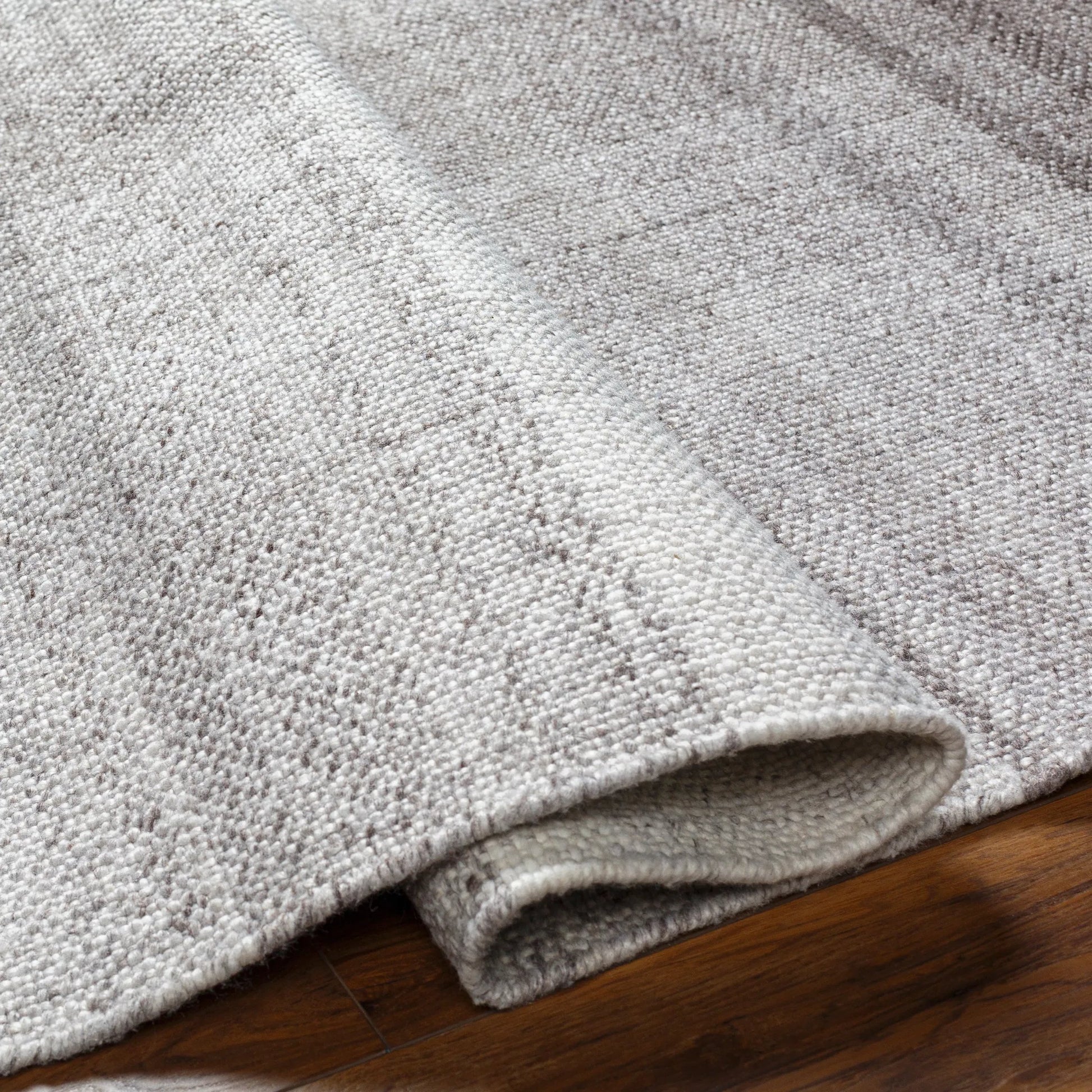 Primrose PRM-2307 Indoor/Outdoor Rug by Livabliss in dark brown, taupe, off-white. Made from 100% recycled pet yarn in a unique style.