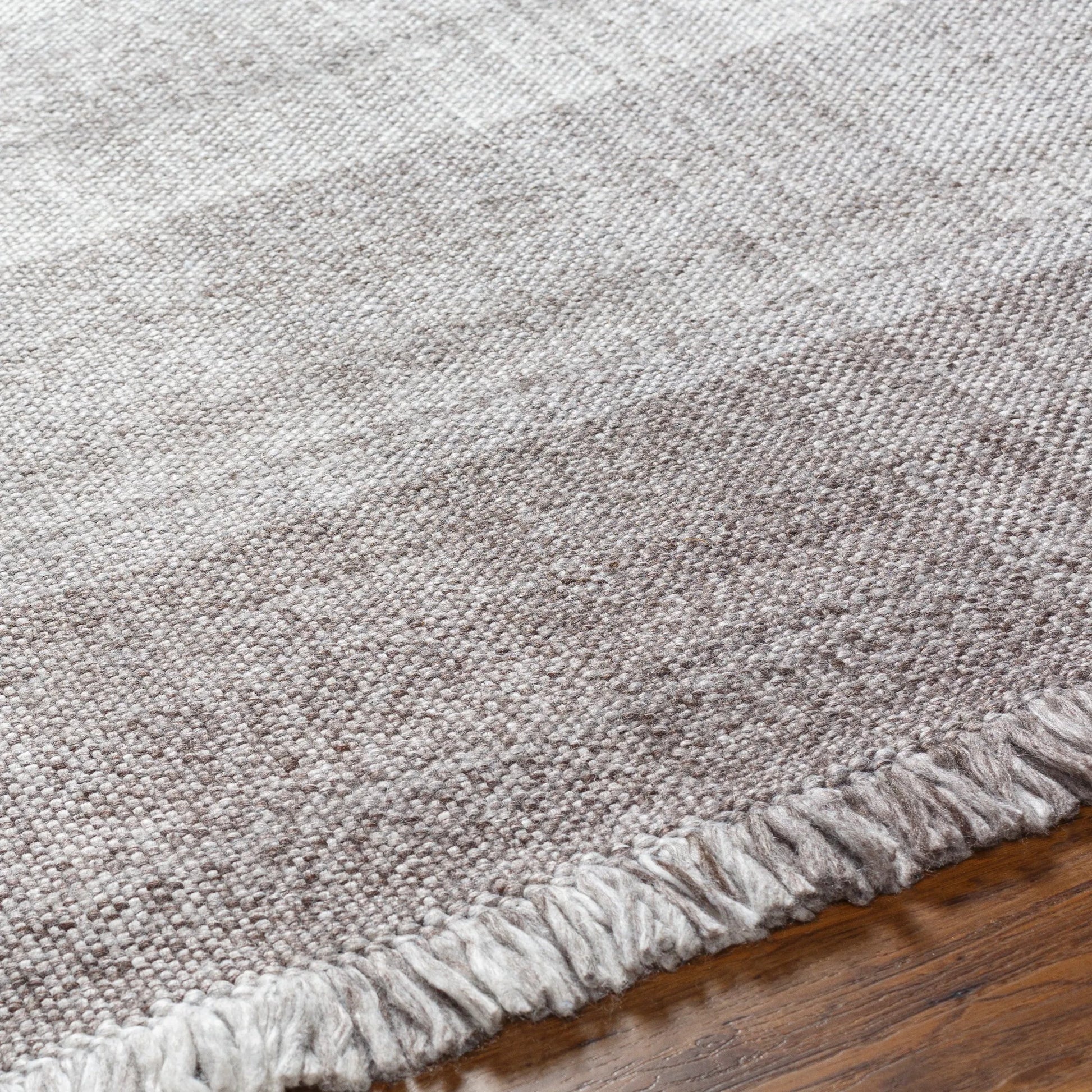Primrose PRM-2307 Indoor/Outdoor Rug by Livabliss in dark brown, taupe, off-white. Made from 100% recycled pet yarn in a unique style.