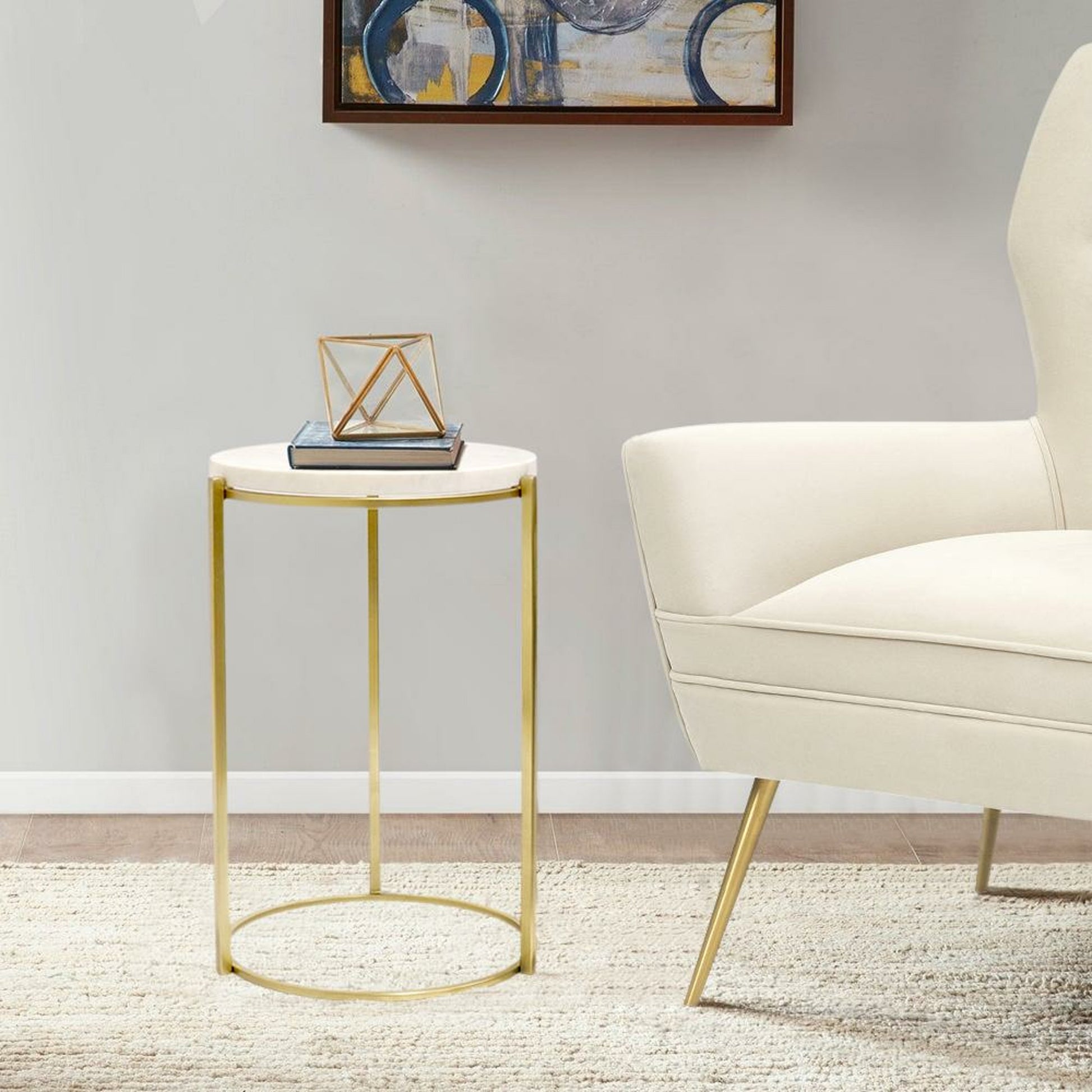 Carina Side Table by Pasargad Home in gold. Made from marble, steel in a transitional style.