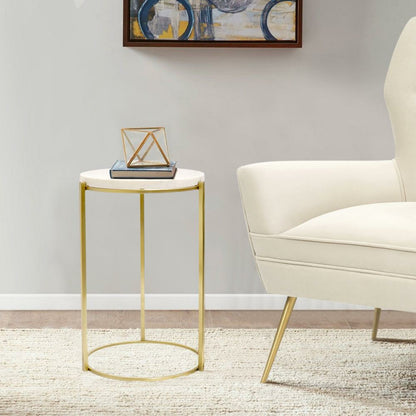 Carina Side Table by Pasargad Home in gold. Made from marble, steel in a transitional style.