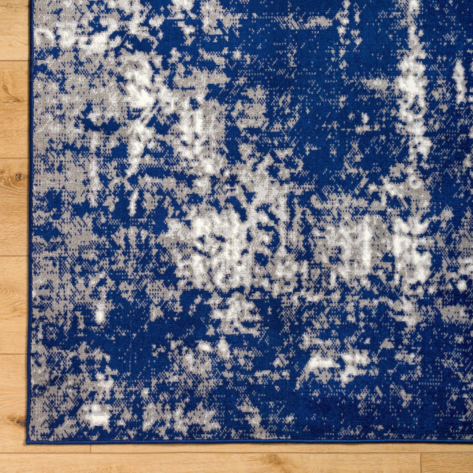 Pisa Rug - 14634 by Livabliss in light gray, medium gray, charcoal, dark blue. Made from face: 100% polypropylene, warp: 100% polypropylene in a unique style.