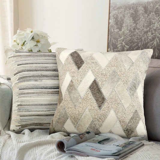 Galaxy Cowhide Pillow by Pasargad Home in ivory. Made from cowhide in a unique style.