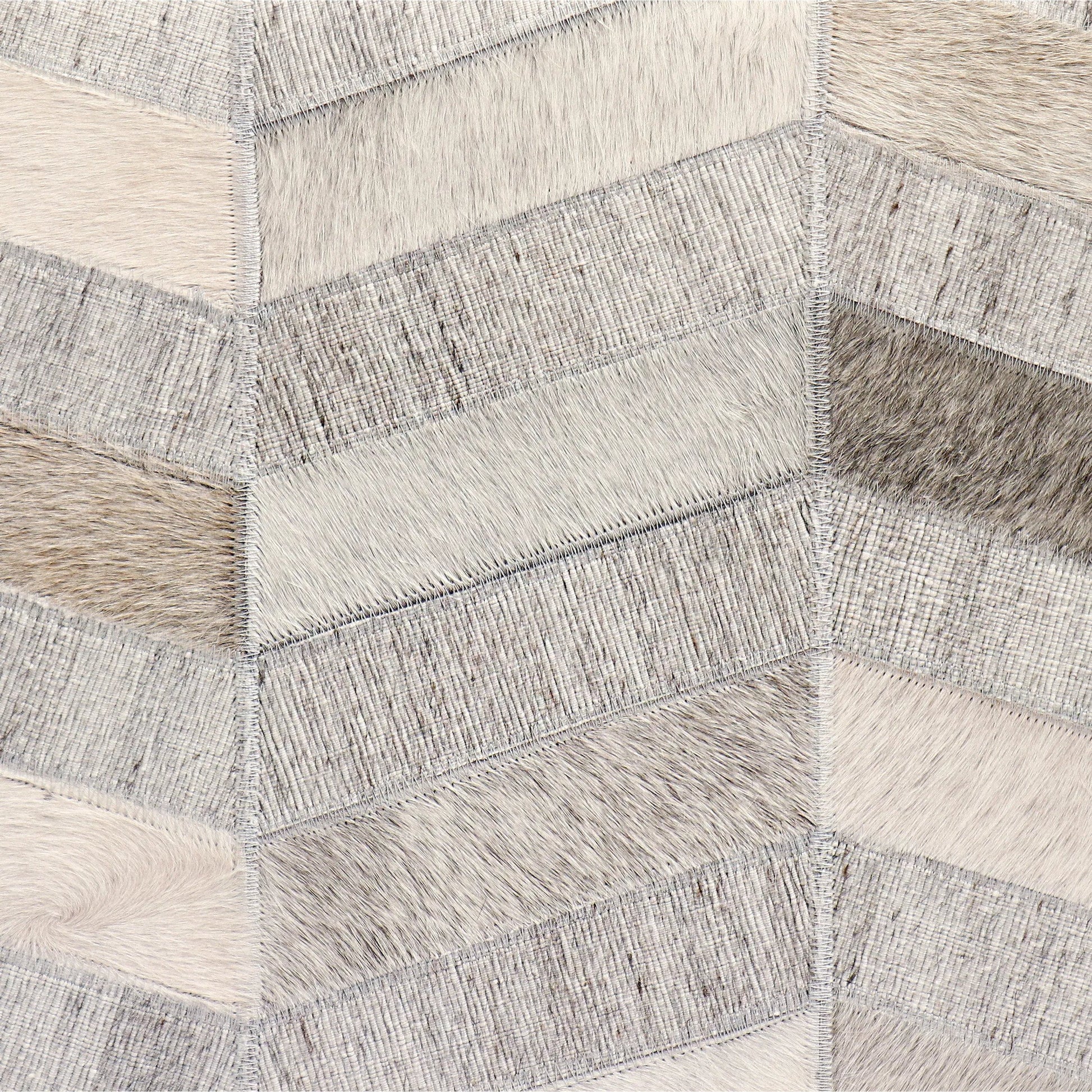 Galaxy Cowhide Zig-Zag Cube Ottoman by Pasargad Home in silver. Made from cowhide, sari silk in a eclectic & global style.