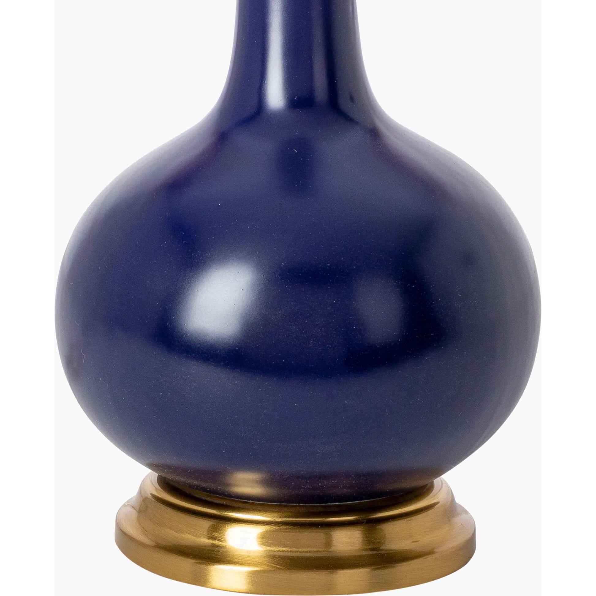 Paityn Table Lamp by Livabliss in body: navy, base: gold, shade (outside): blue, shade (inside): white, finial: metallic - nickel, harp: metallic - nickel, cord: translucent and glazed, plated. Made from body: ceramic, base: meta