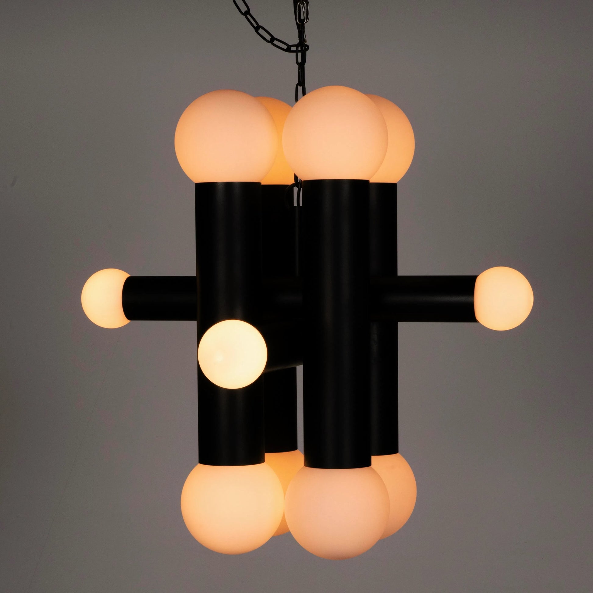 Amadeus Chandelier by Noir in matte black. Made from industrial steel and frosted globes in a modern style.