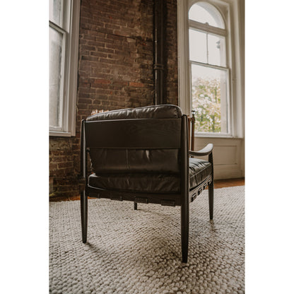 Turner Chair by Moe's Home Collection in black. Made from ash wood frame, top-grain buffalo leather, foam cushion with a feather wrap in a modern style.
