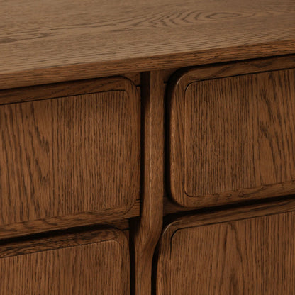 Caroline Sideboard by Moe's Home Collection in warm brown. Made from solid oak frame, oak veneer over mdf side panel, drawer in a transitional style.