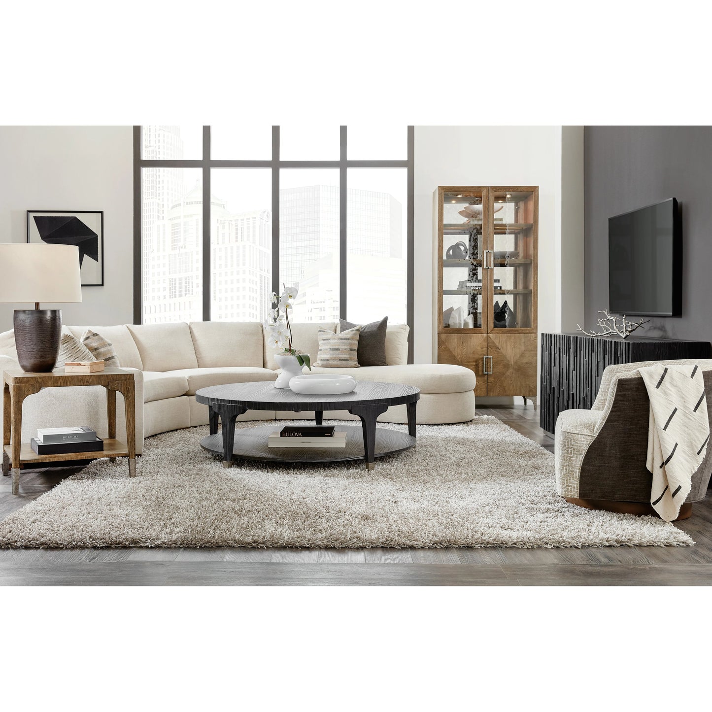 004 SI-1959582 | Lifestyle | Chapman Shou Sugi Ban Round Cocktail Table by Hooker Furniture in charred black. Made from pine veneers, metal ferrules in a modern style.