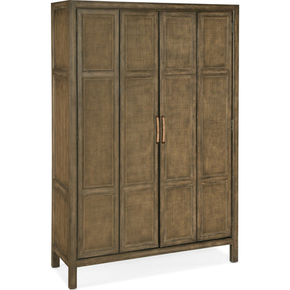 Sundance Bar Cabinet by Hooker Furniture in cliffside. Made from pecan veneers, rattan, glass, puck light, self-closing undermount drawer guides in a transitional style.