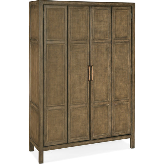 Sundance Bar Cabinet by Hooker Furniture in cliffside. Made from pecan veneers, rattan, glass, puck light, self-closing undermount drawer guides in a transitional style.