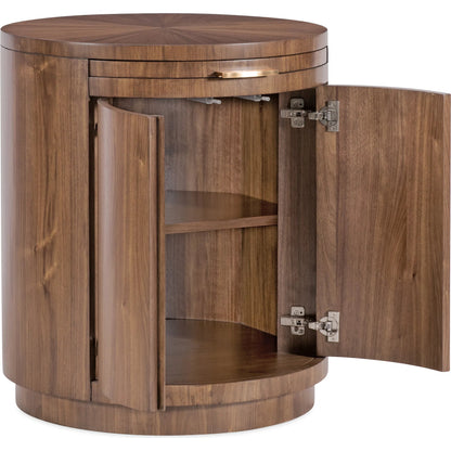 Eleana Round Nightstand by Hooker Furniture in light caramel, quartered walnut veneers, sunlit bronze metal. Made from walnut veneers in a modern style.
