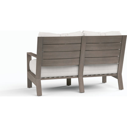Laguna Outdoor Loveseat by Sunset West in browns. Made from aluminum in a modern style.