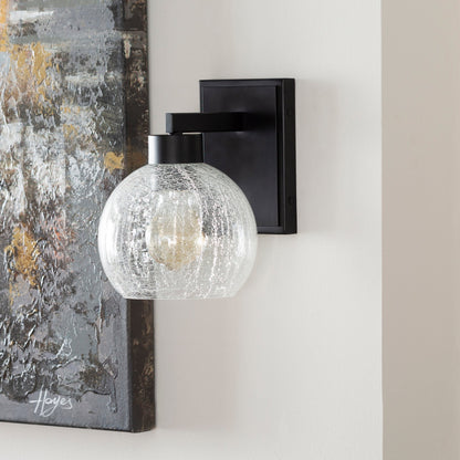Praed Indoor/Outdoor Wall Sconce by Surya in black, clear and paintedpowder coatedcrackle. Made from glass, metal in a transitional style.