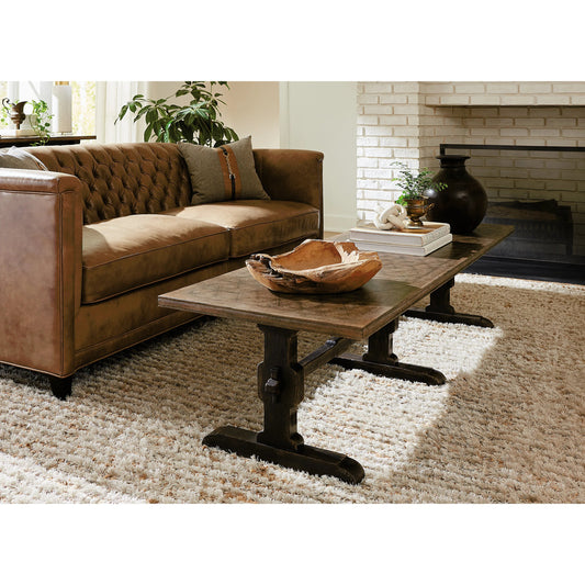 Americana Trestle Rectangle Cocktail Table by Hooker Furniture in black and molasses finish. Made from oak veneers with solid-wood edge top in a modern style.