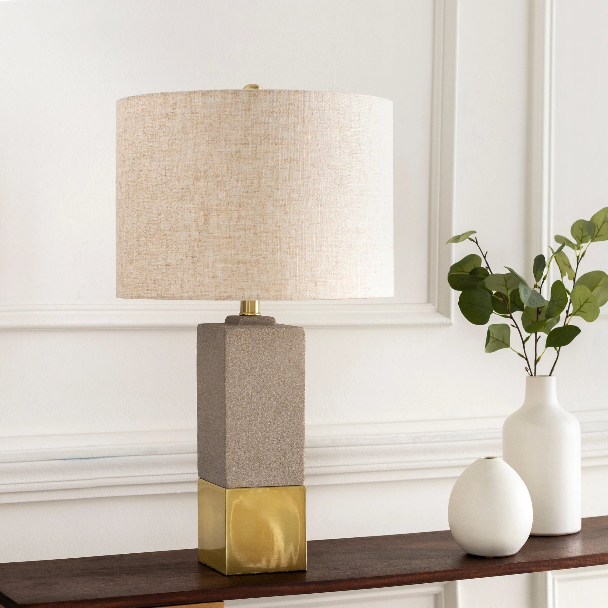 Rodez - 32426 by Surya in gray, black, white, metallic brass and polishednaturalpolished. Made from shade (outside): linen, shade (inside): polyester, body: concrete, base: metal, finial: iron, harp: iron in a modern style.