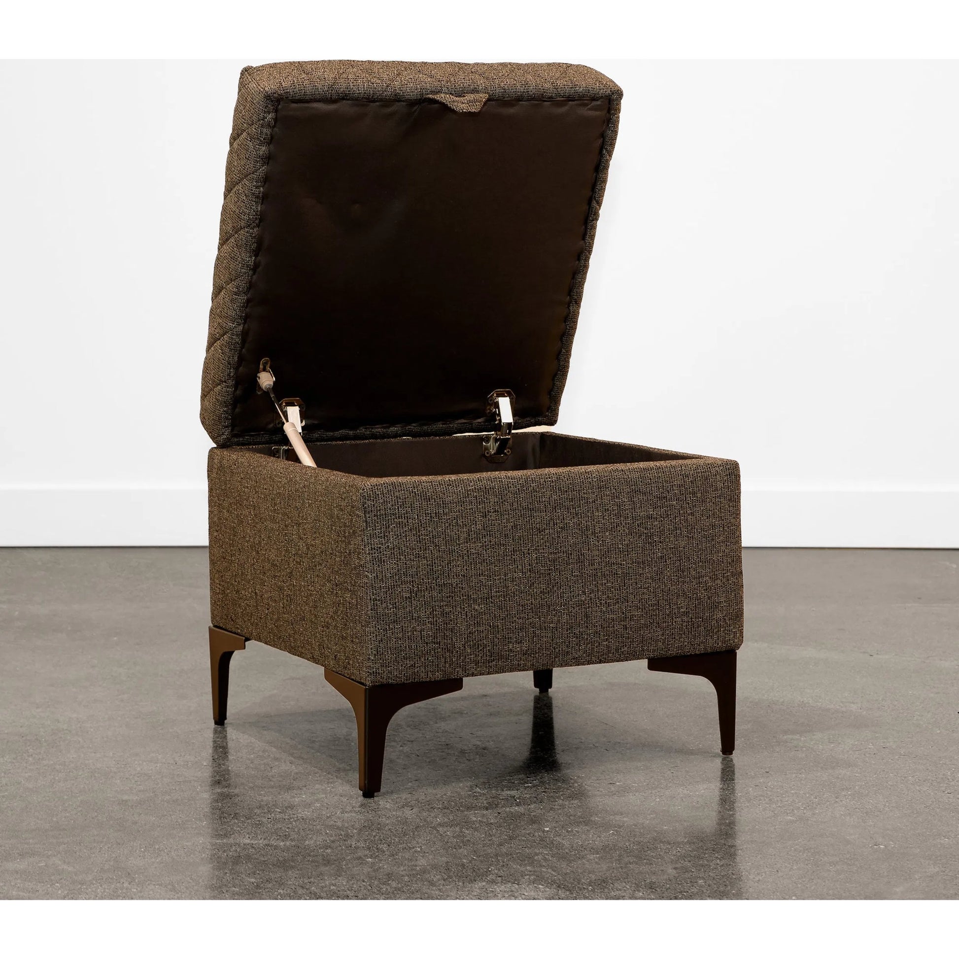 Reece Storage Ottoman by LH Imports in matte black. Made from black metal legs, standard padded foam cushion, 100% polyester fabric in a eclectic & global style.
