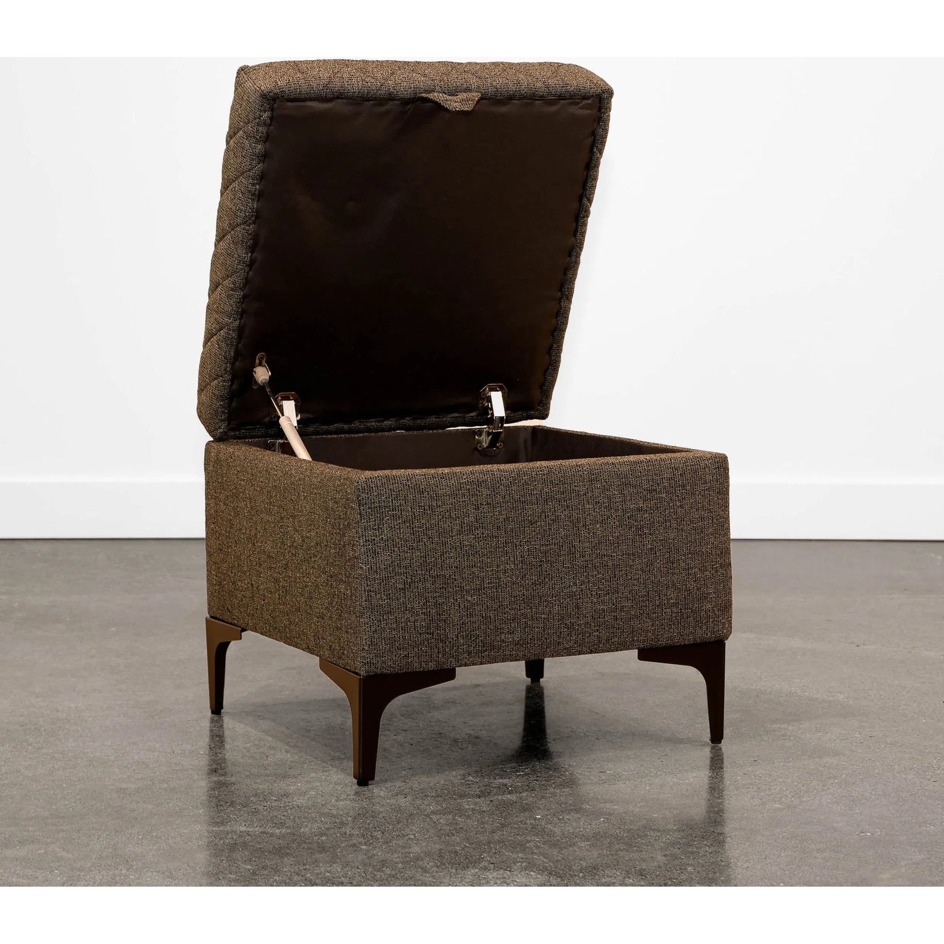 Reece Storage Ottoman by LH Imports in matte black. Made from black metal legs, standard padded foam cushion, 100% polyester fabric in a eclectic & global style.