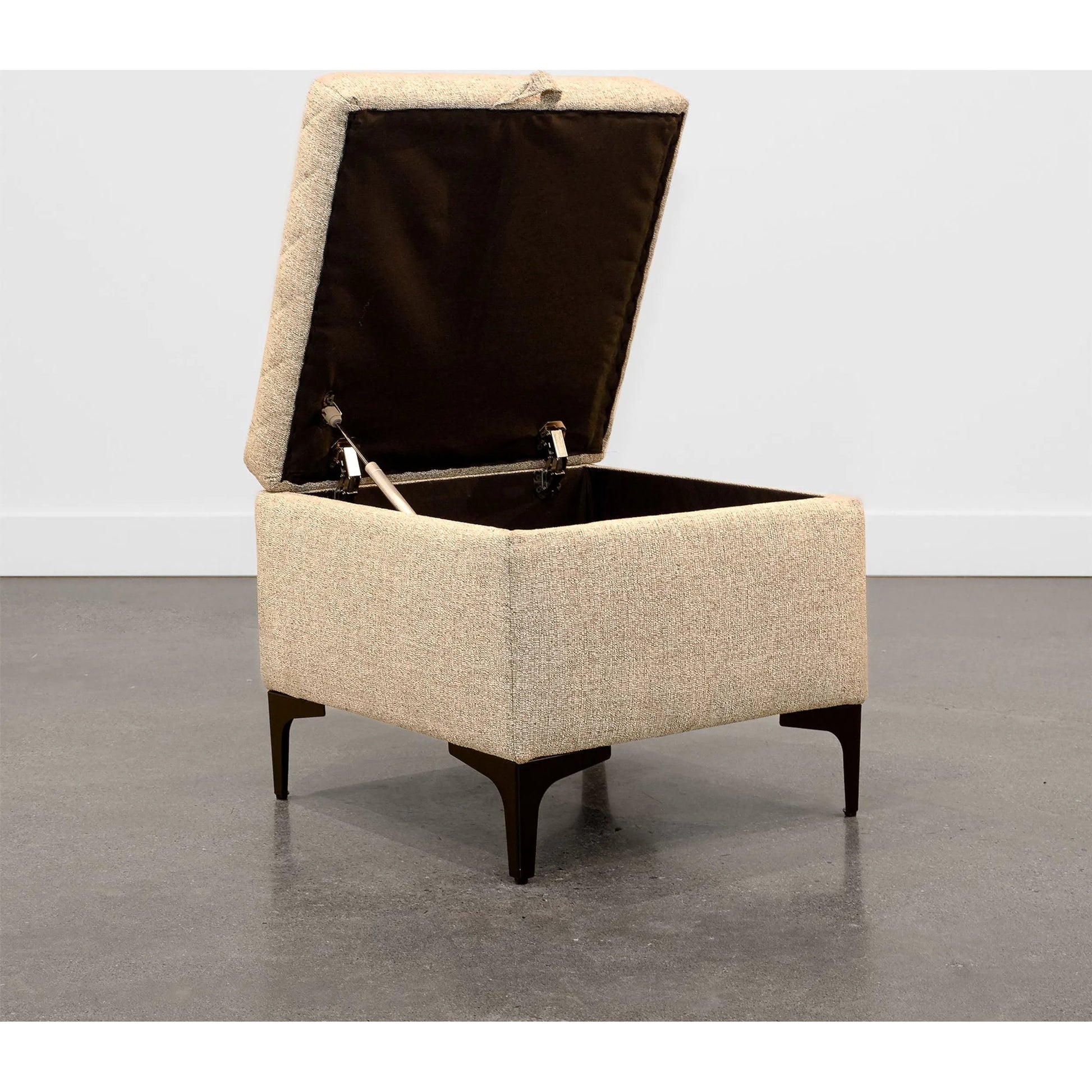 Reece Storage Ottoman by LH Imports in matte black. Made from black metal legs, standard padded foam cushion, 100% polyester fabric in a eclectic & global style.